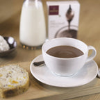White Domori Hot Chocolate Mix in rich ceramic cup on saucer