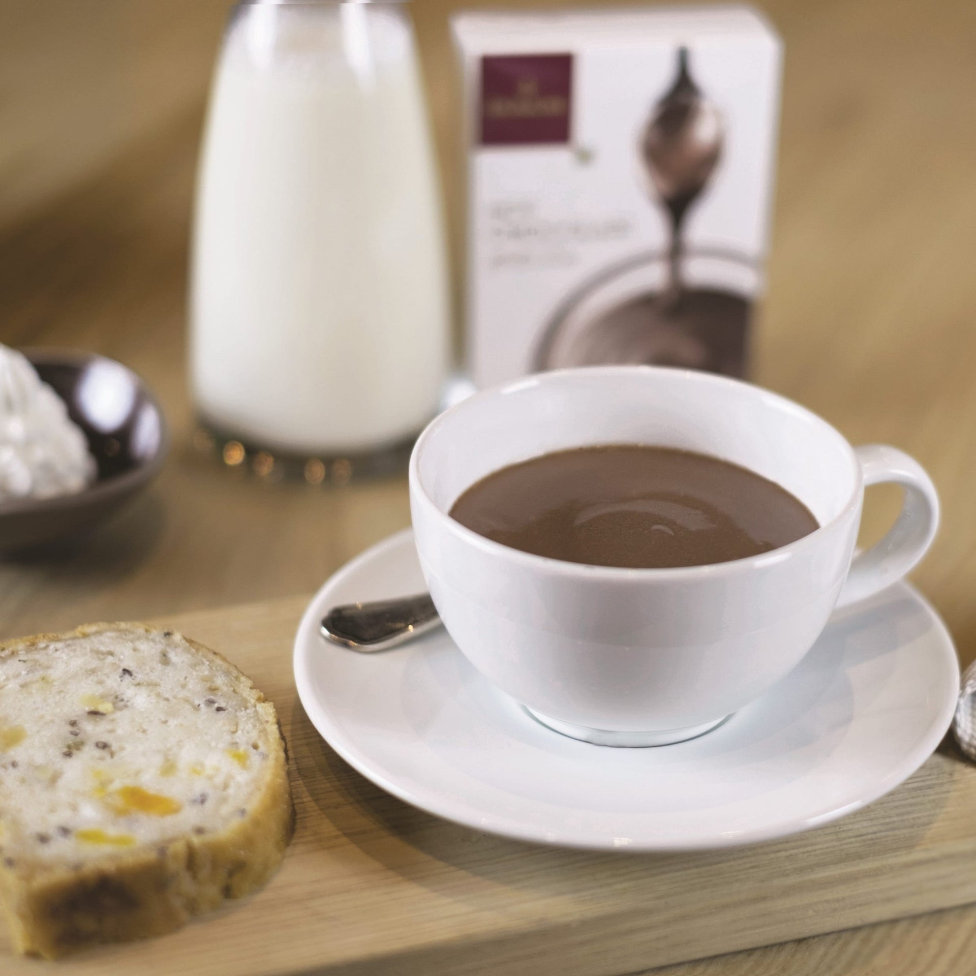 White Domori Hot Chocolate Mix in rich ceramic cup on saucer