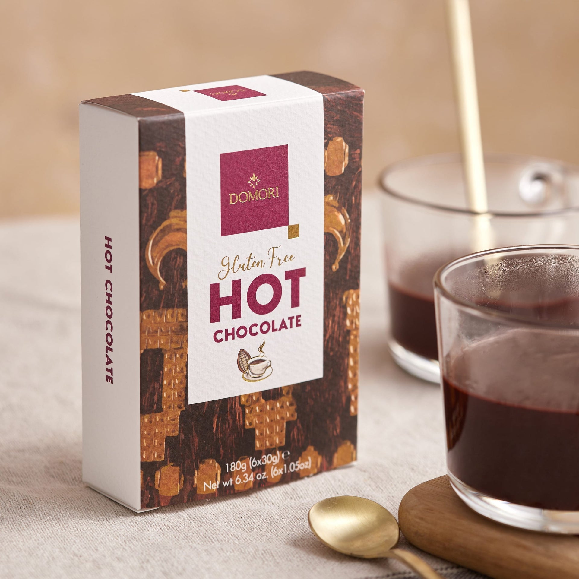 Domori gluten-free hot chocolate mix in rectangular box with maroon label