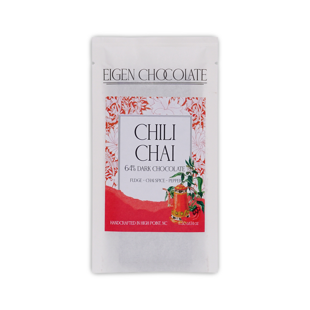 White Eigen Chocolate pouch with a red floral panel and a spice pot illustration, reading Chili Chai 64% Dark Chocolate, 50 g.