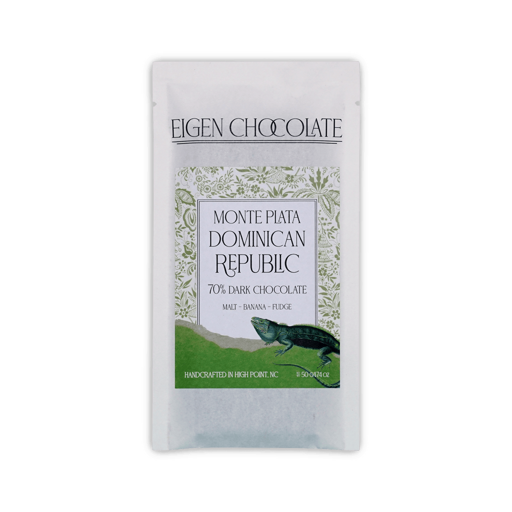 Eigen Chocolate pouch with a green iguana and floral pattern, reading Monte Plata Dominican Republic, 70% Dark Chocolate, 50 g.