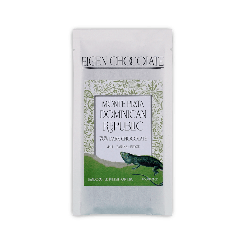 Eigen Chocolate pouch with a green iguana and floral pattern, reading Monte Plata Dominican Republic, 70% Dark Chocolate, 50 g.