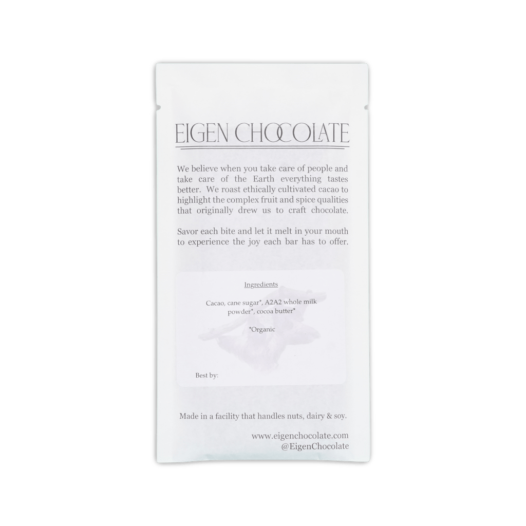 Back of Eigen Chocolate white pouch, brand text about ethically cultivated cacao, ingredients list