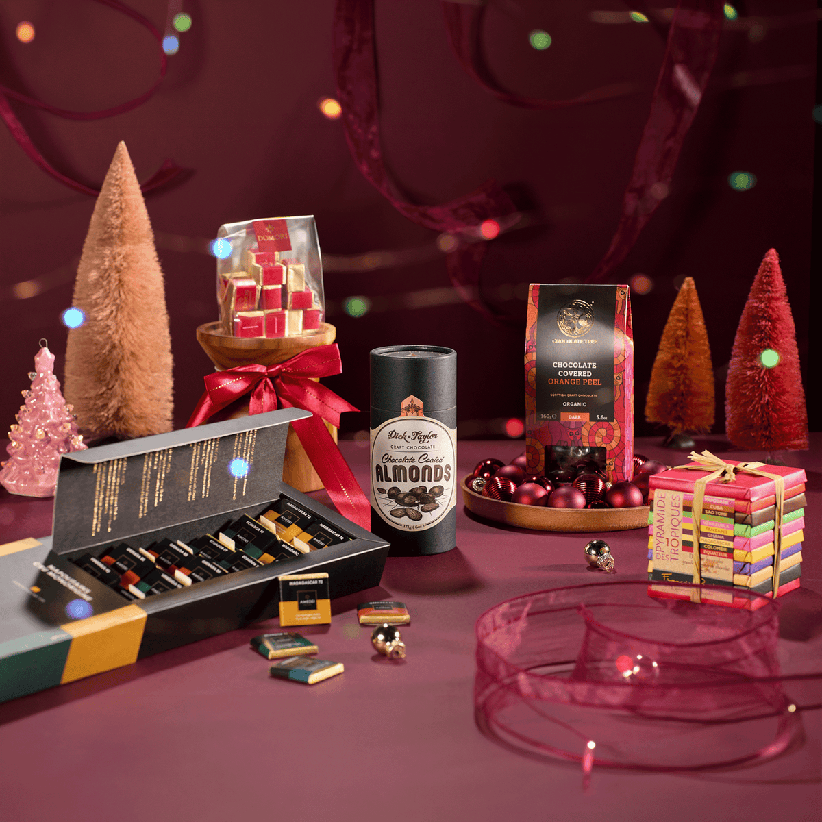 Executive Desk chocolates in a holiday setting with small trees and ornaments