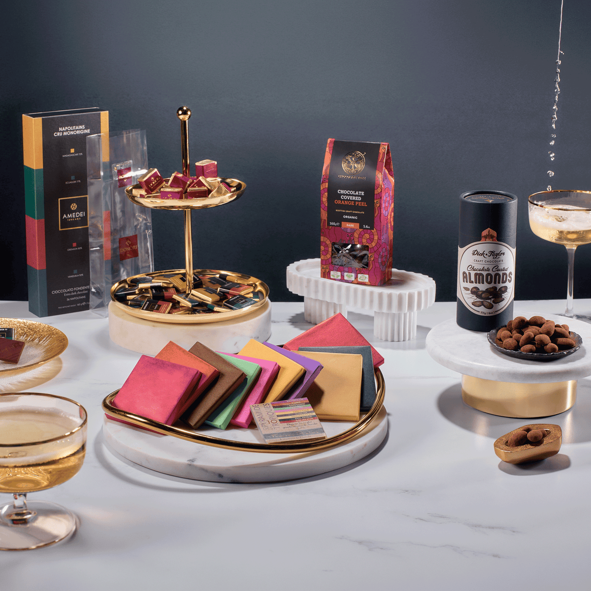 Executive Desk shareable chocolates displayed on marble and gold stands