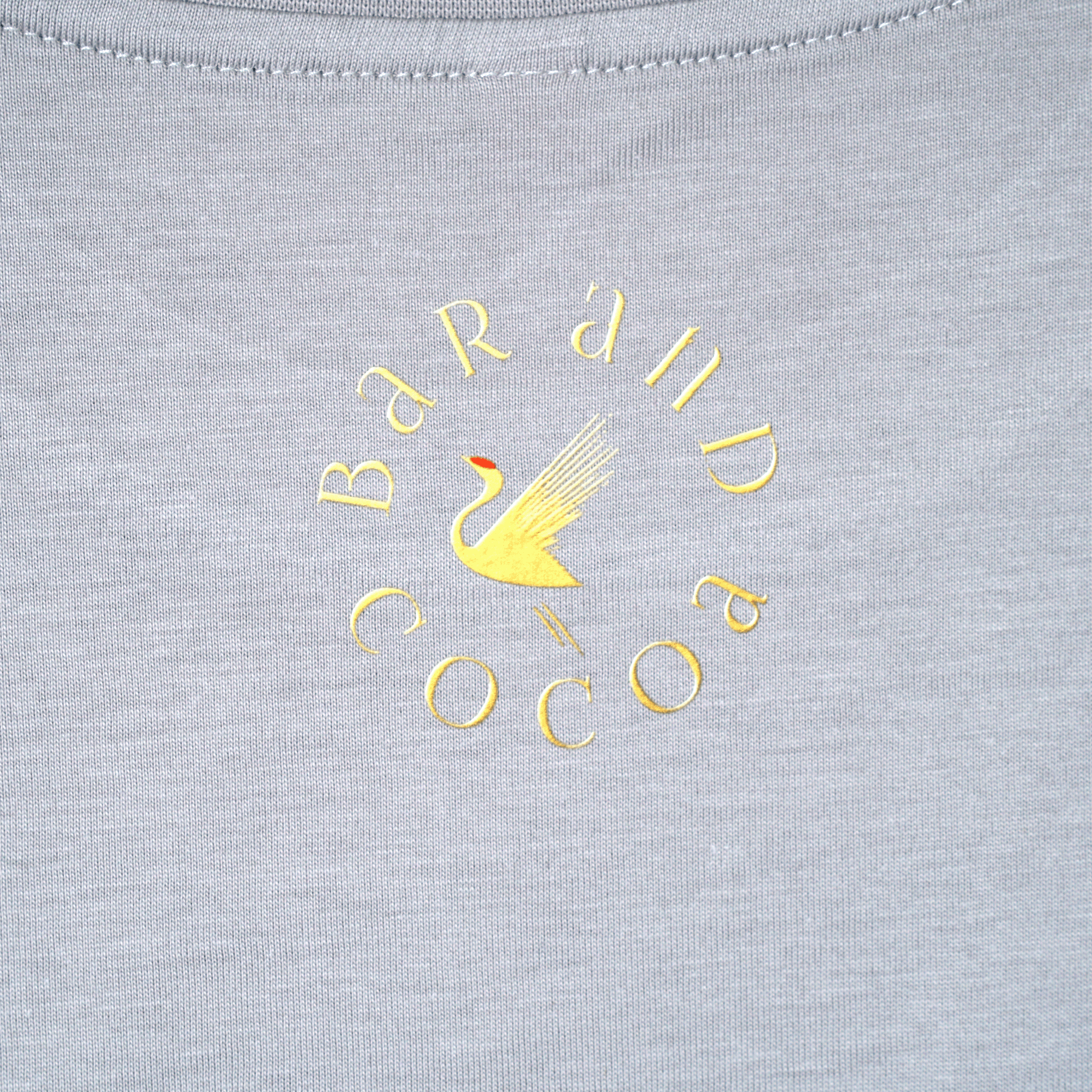 Gray Find Your Inner Piece Tee with gold bar and cocoa swan logo