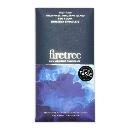 A sleek dark milk chocolate bar from Firetree with a blue and purple marbled wrapper and white text