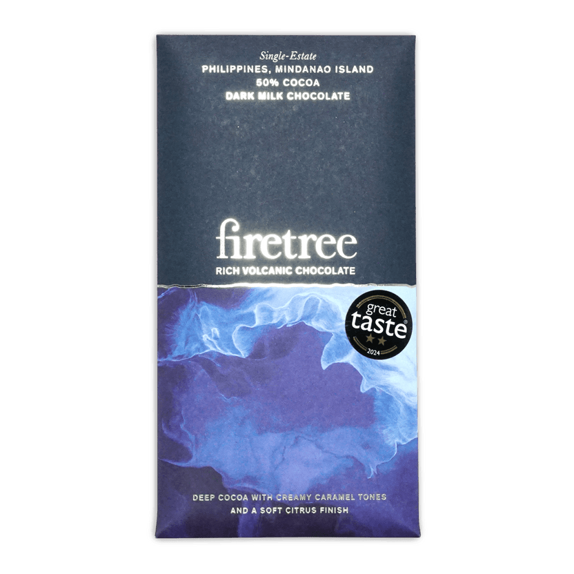A sleek dark milk chocolate bar from Firetree with a blue and purple marbled wrapper and white text
