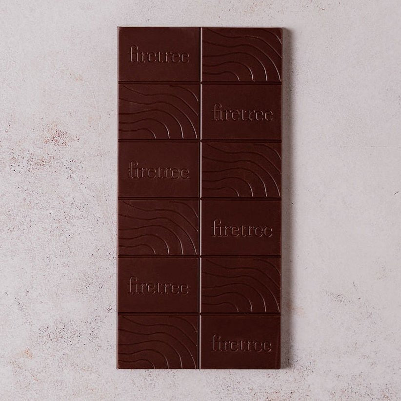 Firetree Dark Tanzania Kilombero Valley 72% chocolate bar on a textured surface