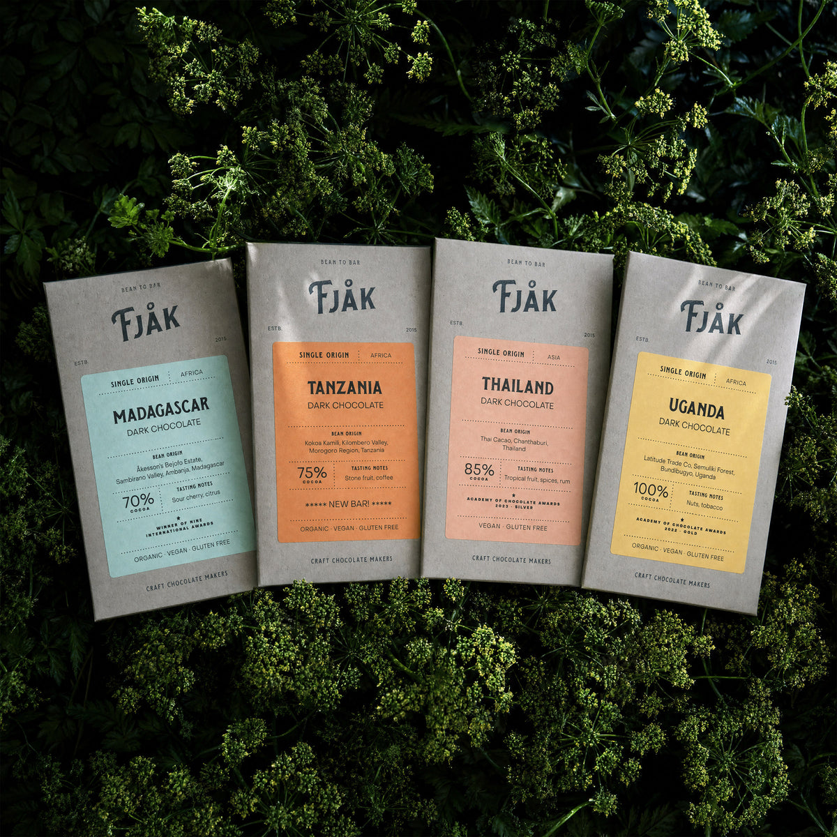 Four Fjåk bars on fresh greenery.