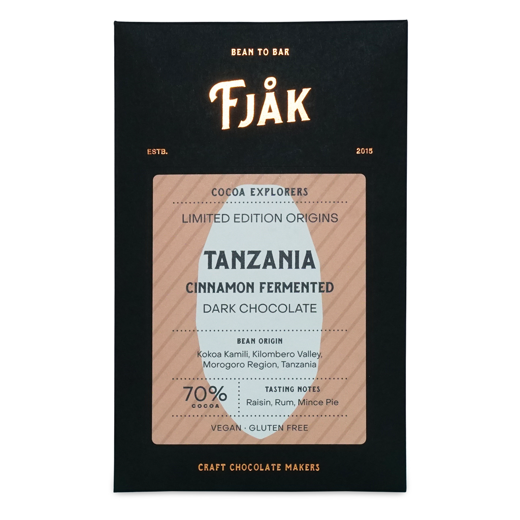 Fjåk cinnamon fermented Tanzania microlot 70% dark chocolate bar in sleek black and beige packaging explorer series