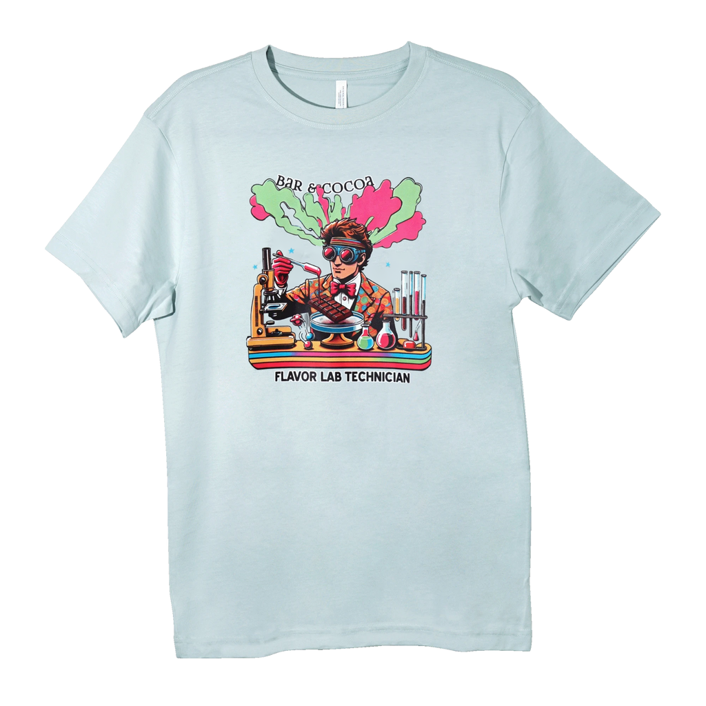 A light blue t-shirt printed with a scientist graphic, chocolate, and the text BAR & COCOA FLAVOR LAB TECHNICIAN.