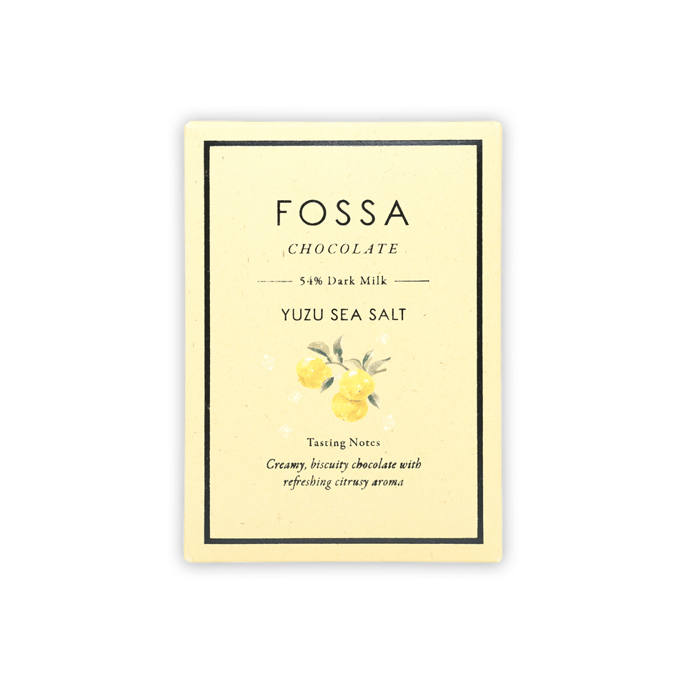 Fossa 54% dark milk yuzu sea salt bar in cream wrapper with yuzu art