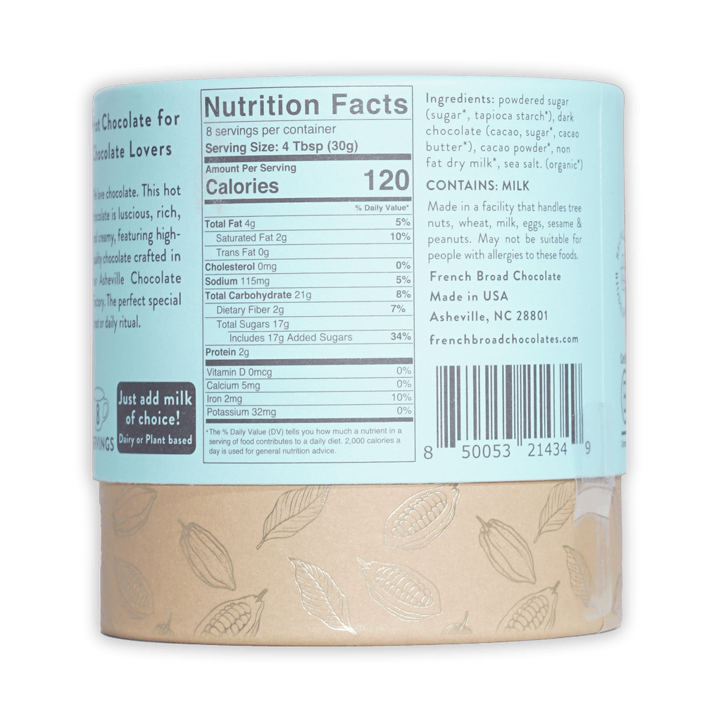 French Broad Milk Hot Chocolate Mix light beige matte cylinder with silver cocoa pod leaf patterns