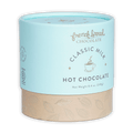 French Broad Milk Hot Chocolate Mix in light blue cylindrical can with beige base and gold leaf patterns