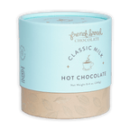 French Broad Milk Hot Chocolate Mix in light blue cylindrical can with beige base and gold leaf patterns