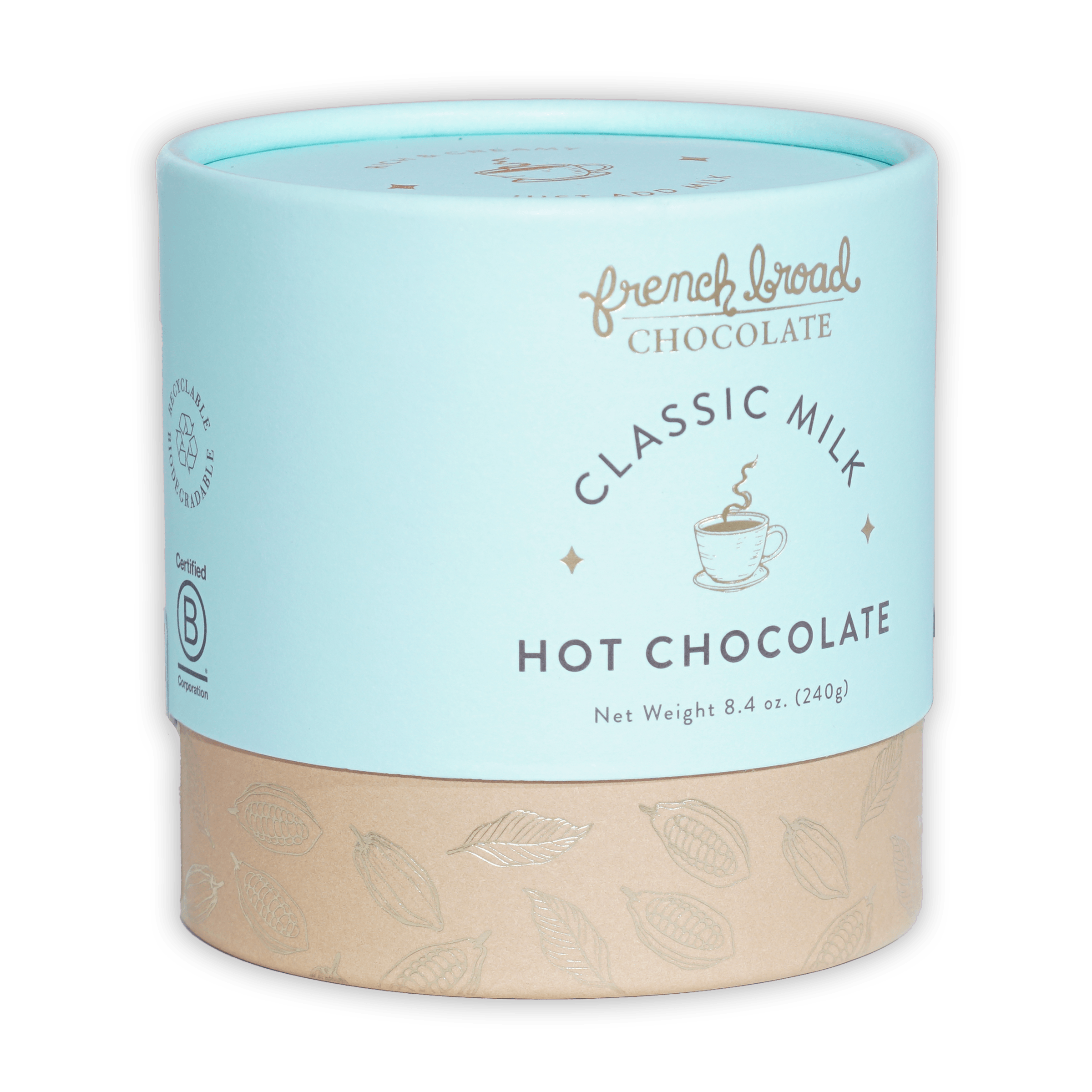 French Broad Milk Hot Chocolate Mix in light blue cylindrical can with beige base and gold leaf patterns
