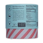 French Broad Peppermint Hot Chocolate: cylindrical can with light blue label and red-white striped base