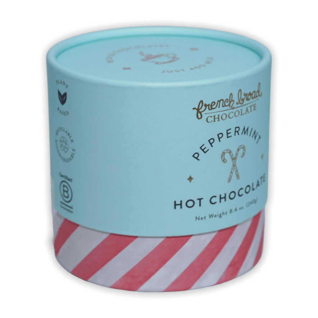 French Broad peppermint hot chocolate in mint green red-striped cylinder