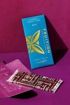 Fruition Colombia Tumaco Dark 85% bar box and inner wrapper on a purple background