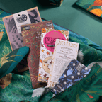Five craft chocolate bars fanned out on Bar & Cocoa crane print furoshiki