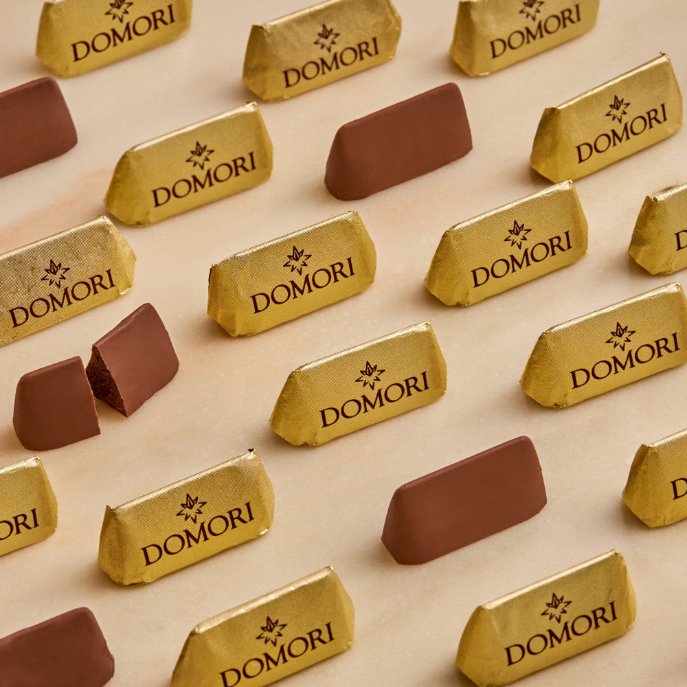 Gold-wrapped Domori Classic Giandujotti Bag with rich brown cocoa coating