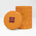 Domori Giandujotti & dark truffles tin with gold stars and logo lid
