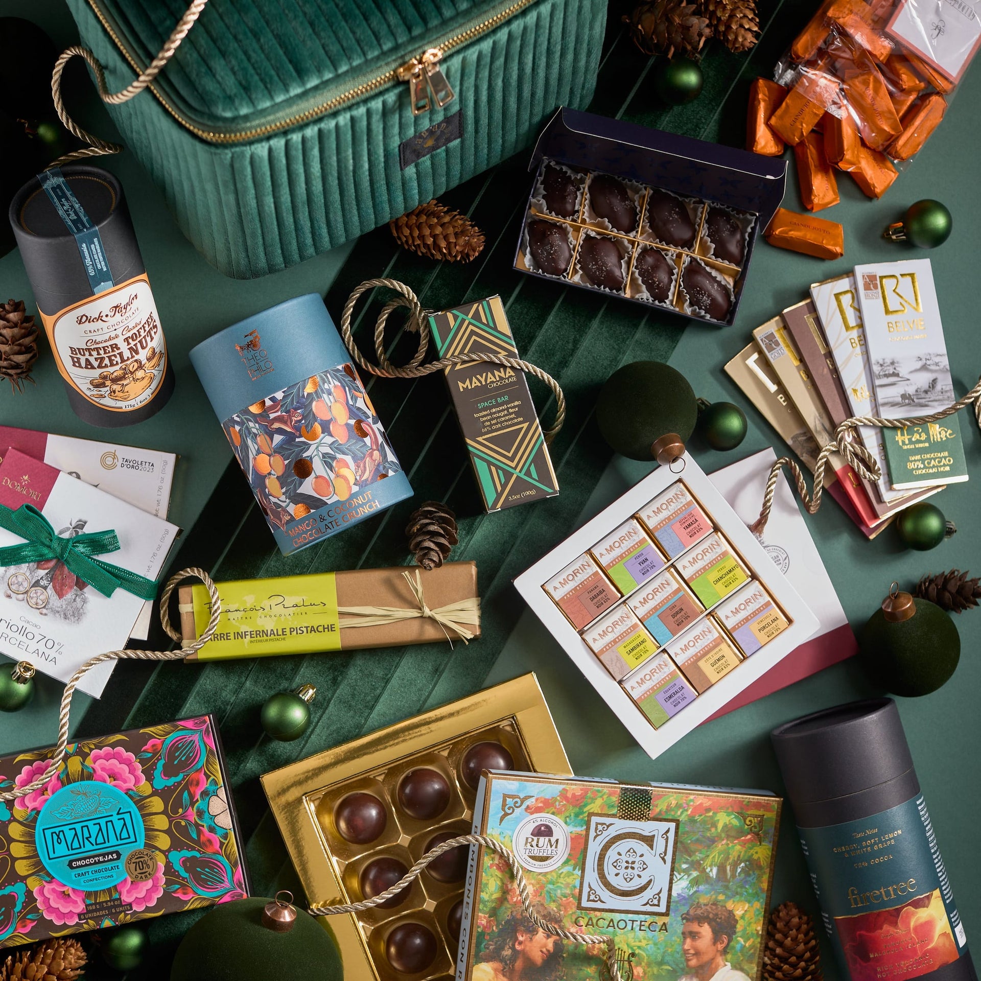 Emerald green velvet Grand Chocolate Voyage gift box with gold zipper handle
