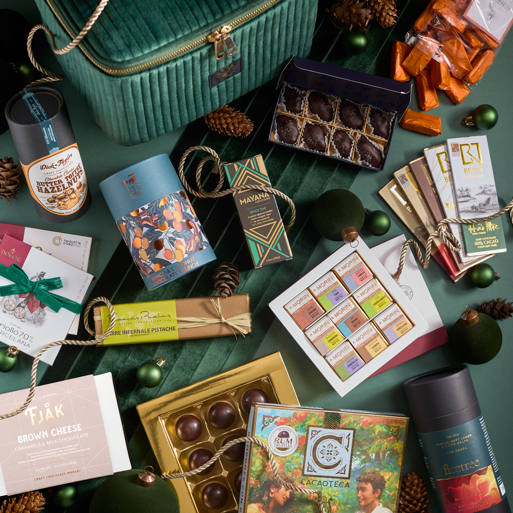 Grand Chocolate Voyage Luxury Gift: vibrant chocolates in colorful wrappers with velvet travel box