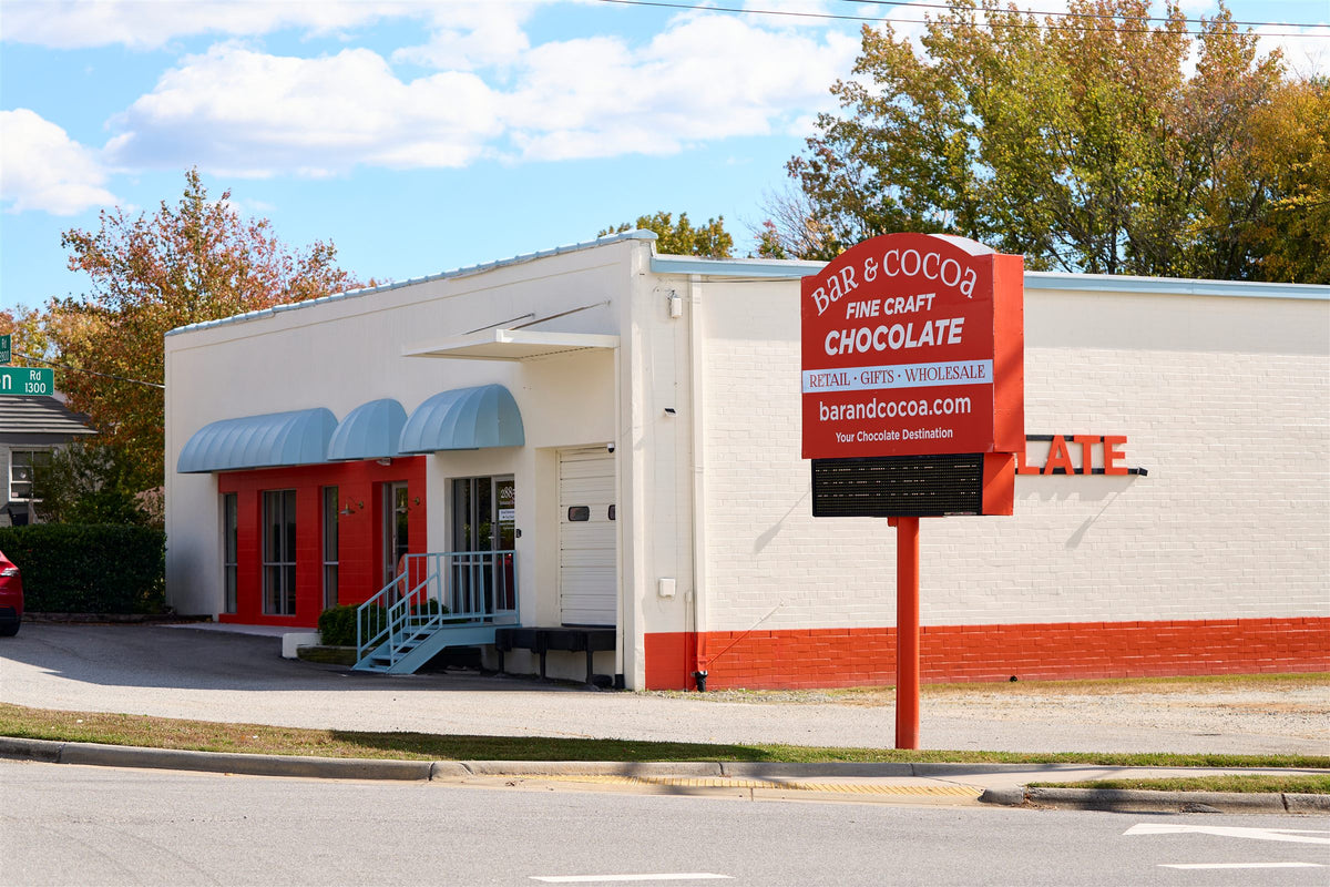 Bar & Cocoa building and red roadside sign on Immanuel Road in Greensboro