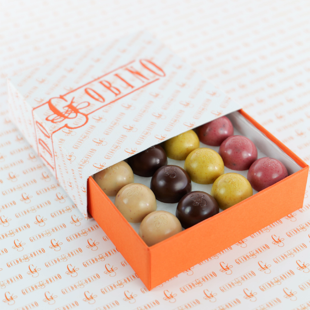 Guido Gobino Fruit & Spice Semisphere 32pc truffles in orange box
