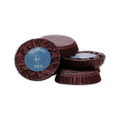 Stack of burgundy foil wrapped Guido Gobino chocolate disks, front label reads Filippine 75%