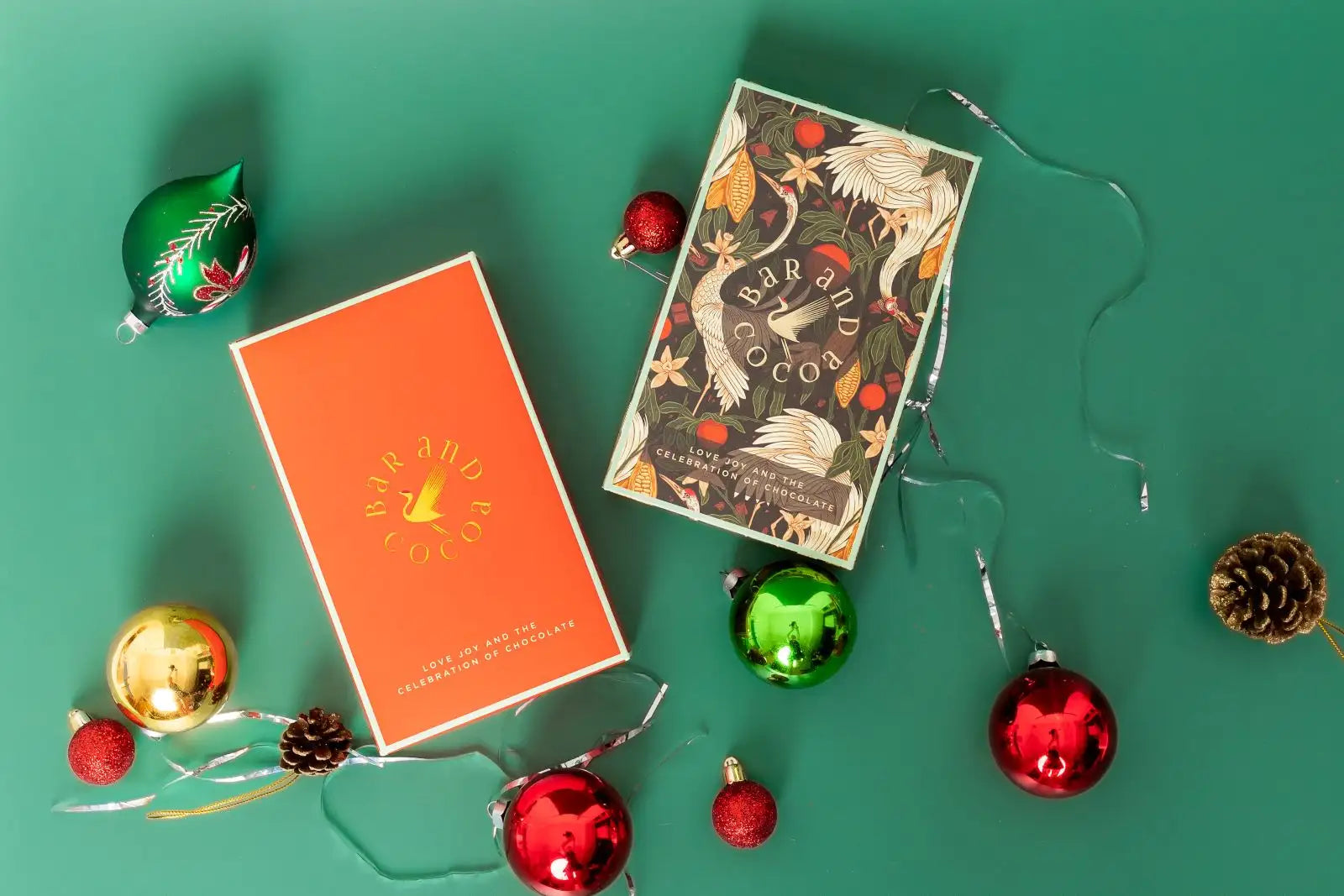 Orange rectangular box with ’bar and cocoa’ logo in gold lettering, featuring a minimalist design on its front surface.