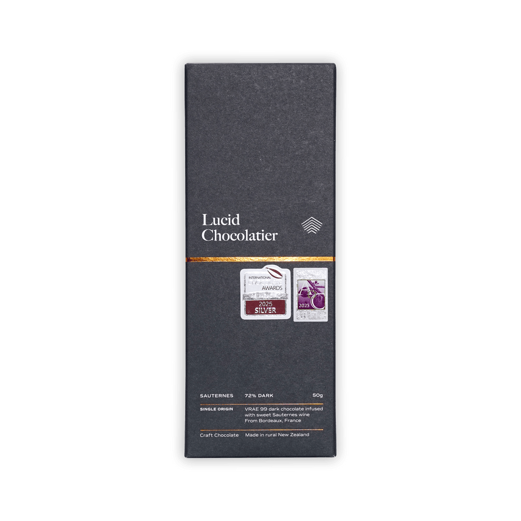 Lucid Chocolatier bar, dark grey box with gold band and award stickers, marked Sauternes 72% Dark, made in New Zealand.