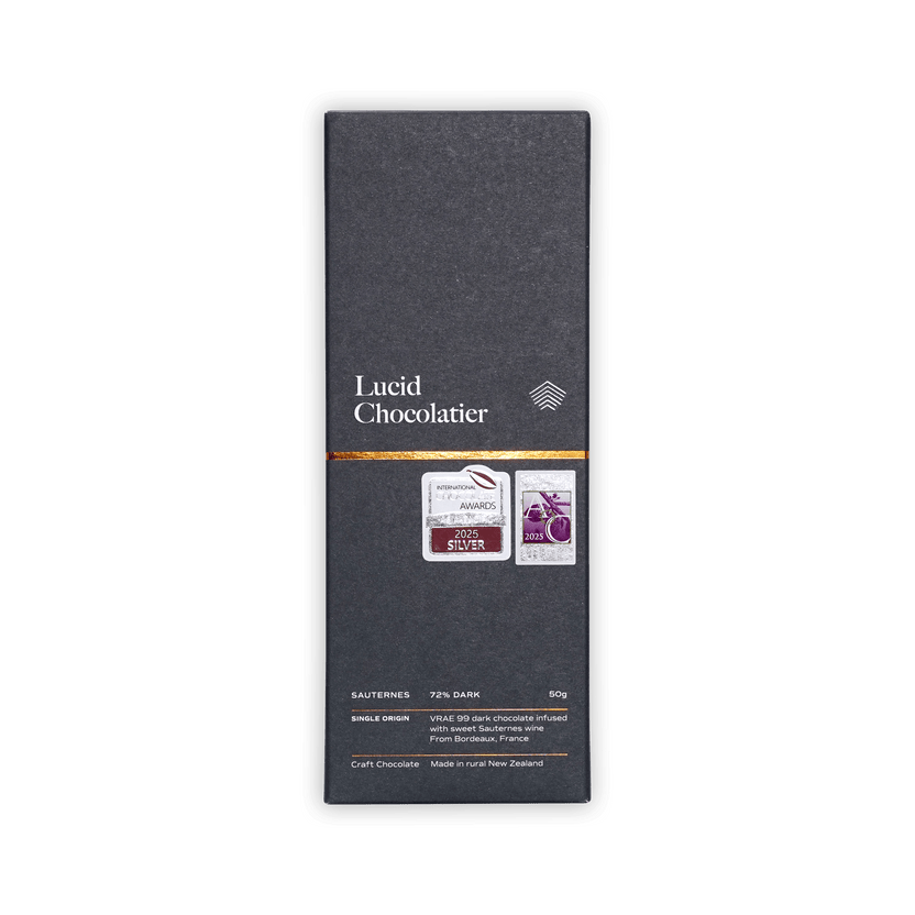 Lucid Chocolatier bar, dark grey box with gold band and award stickers, marked Sauternes 72% Dark, made in New Zealand.
