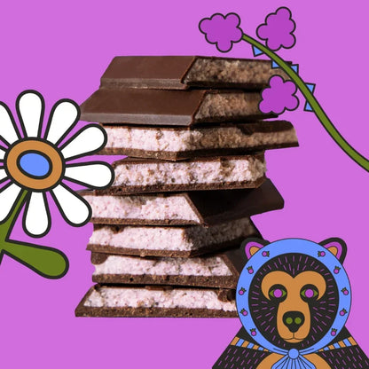 Stack of Maeve Hungry Blackberry Truffle Bars with creamy filling