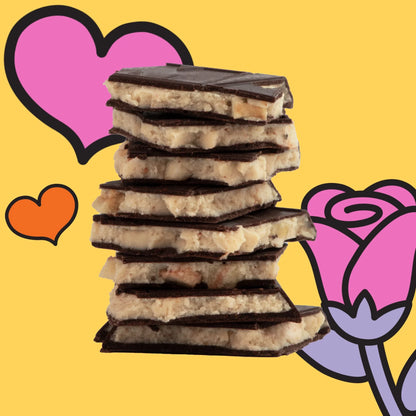 Stack of Maeve Peanut Butter Banana Affair Truffle Bars with dark chocolate-coated coconut and nuts
