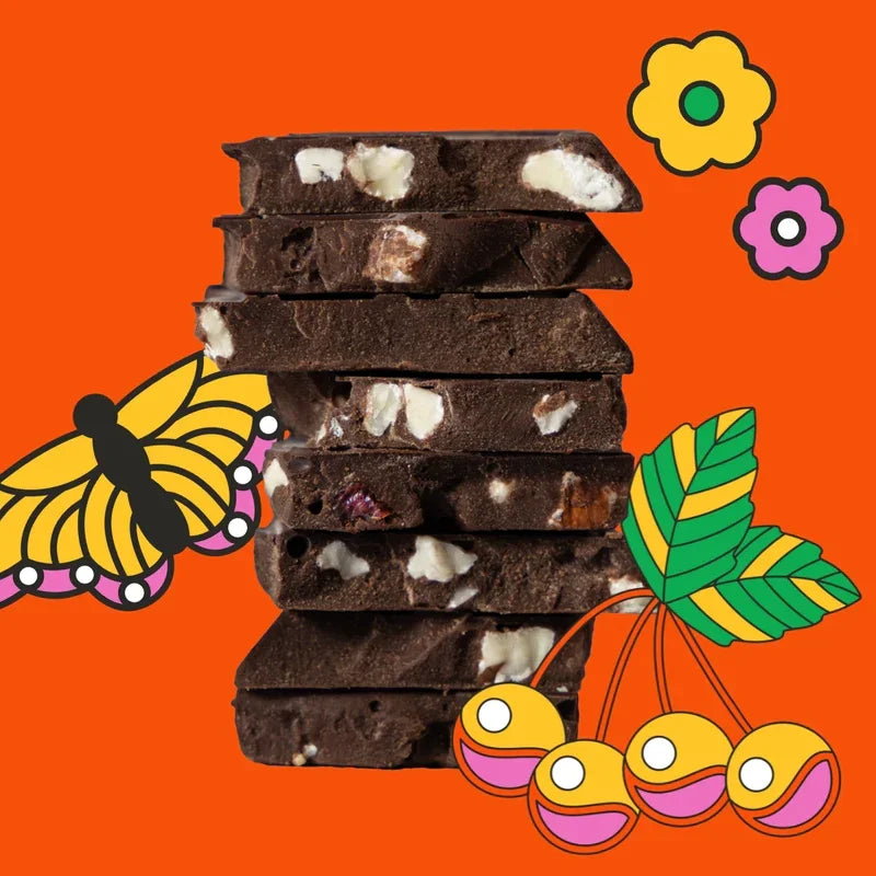 Maeve Rainier Cherry Truffle Bar: stack of dark chocolate with fruit pieces