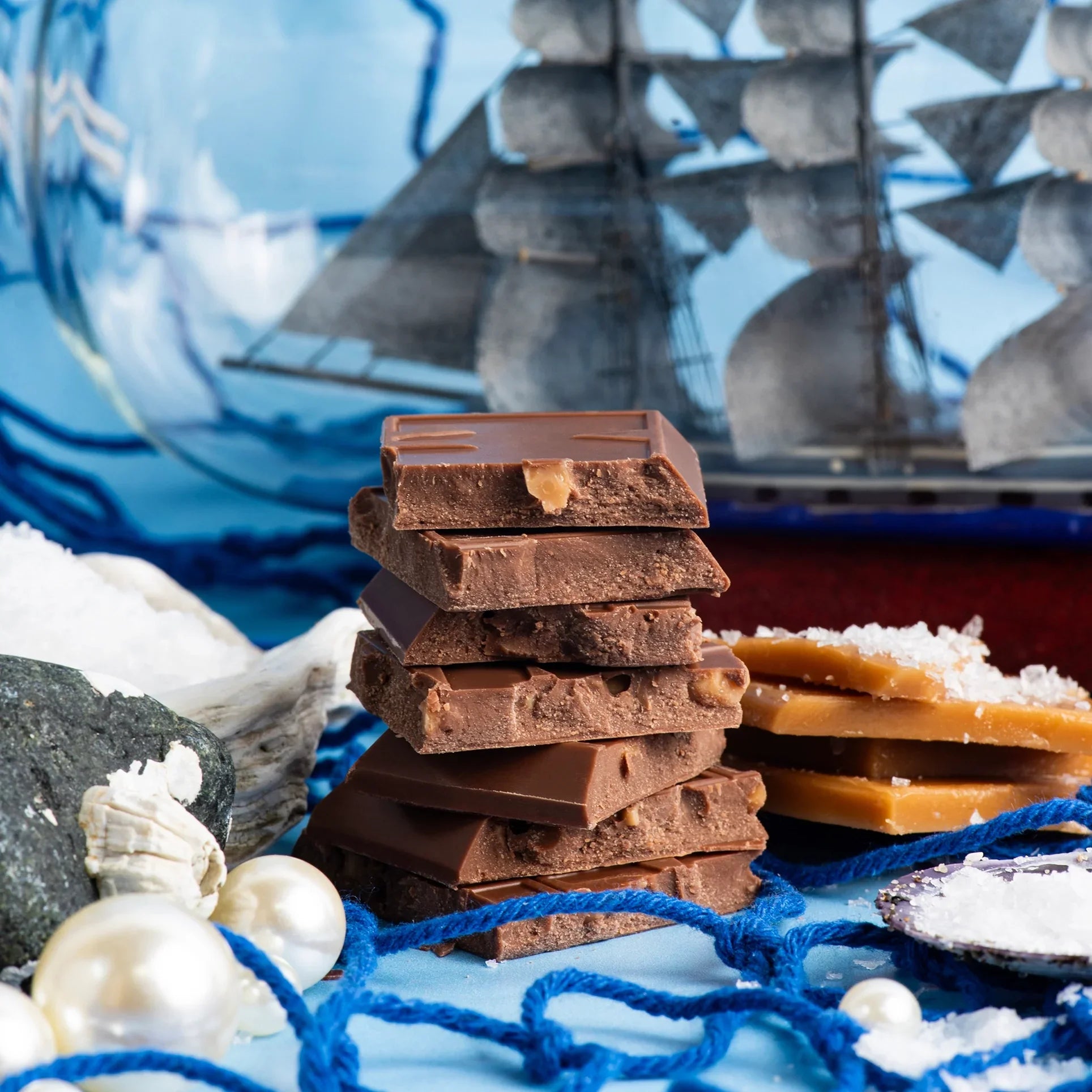 Maeve San Juan salted toffee truffle bar stack with caramel pockets on nautical surface