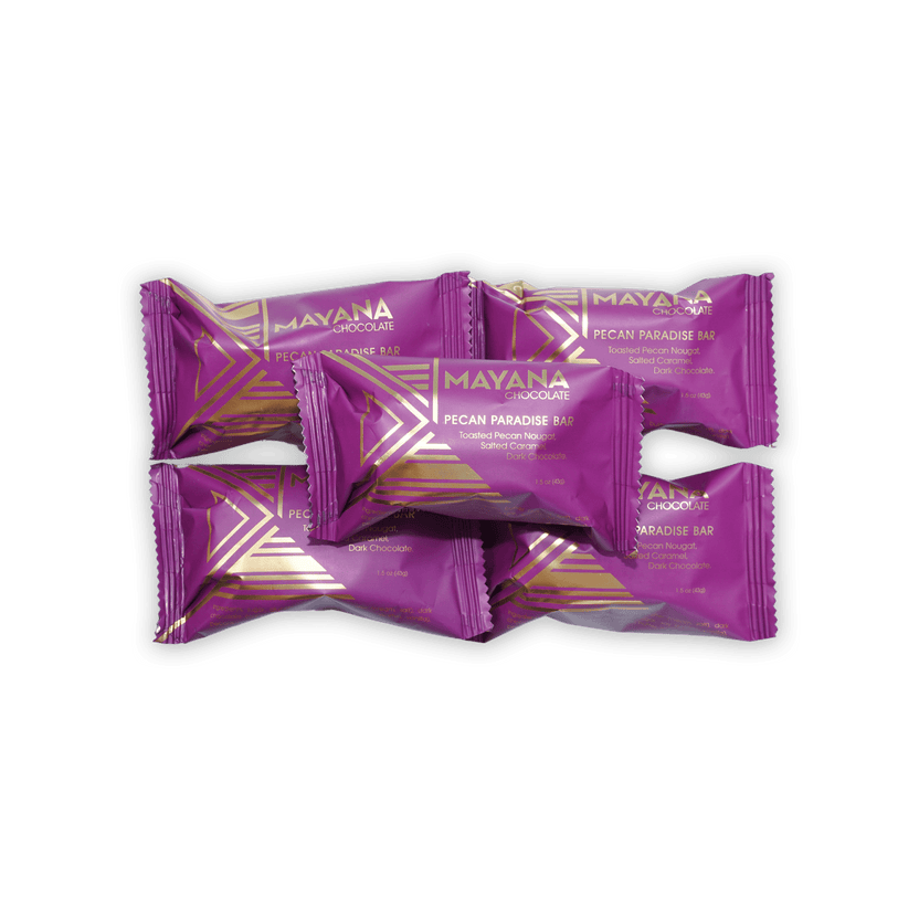 Purple and gold wrapped Mayana Chocolate Mini Pecan Paradise bars