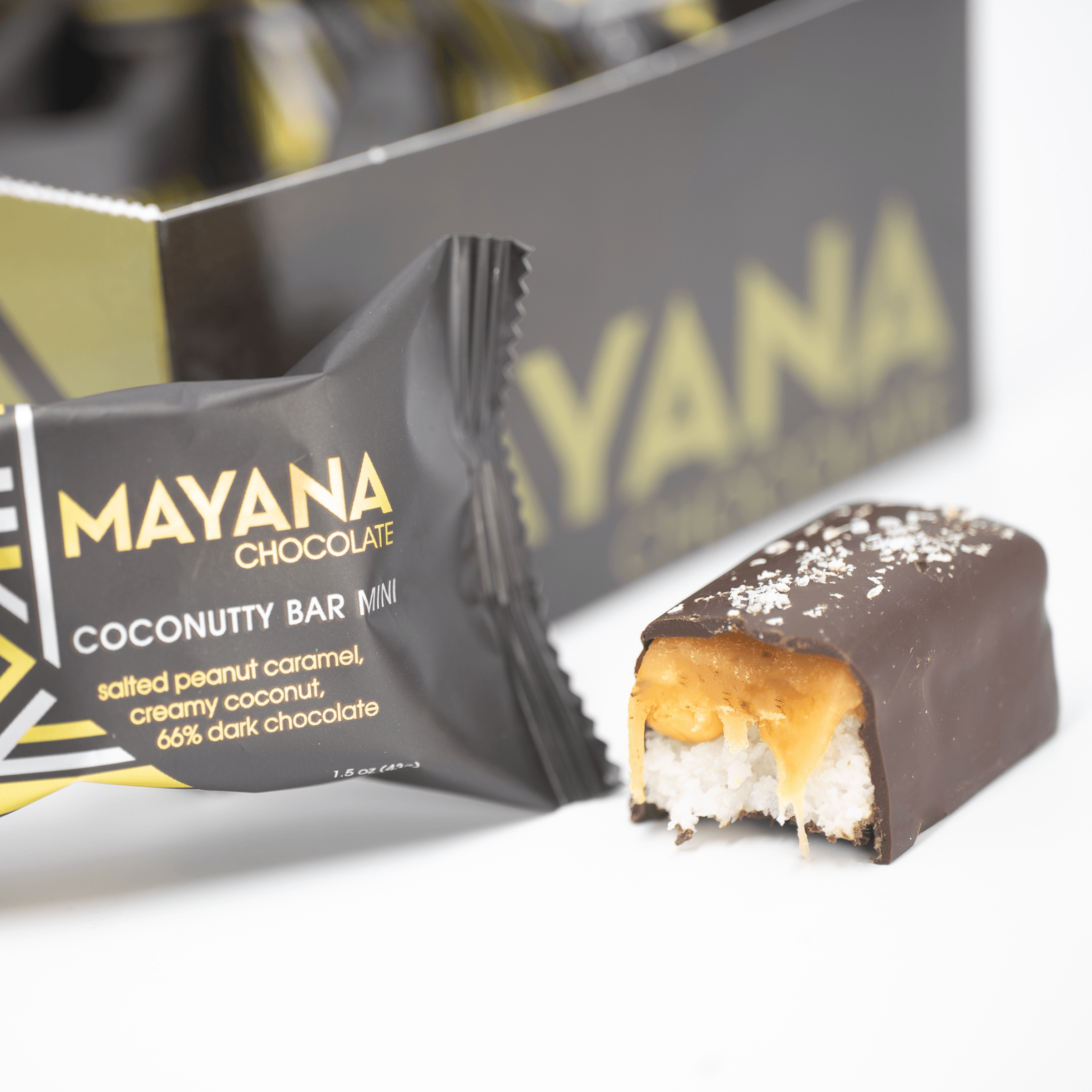 Mayana Chocolate Mini Coconutty Bar with bite revealing coconutty filling