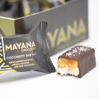 Mayana Chocolate Mini Coconutty Bar with bite revealing coconutty filling