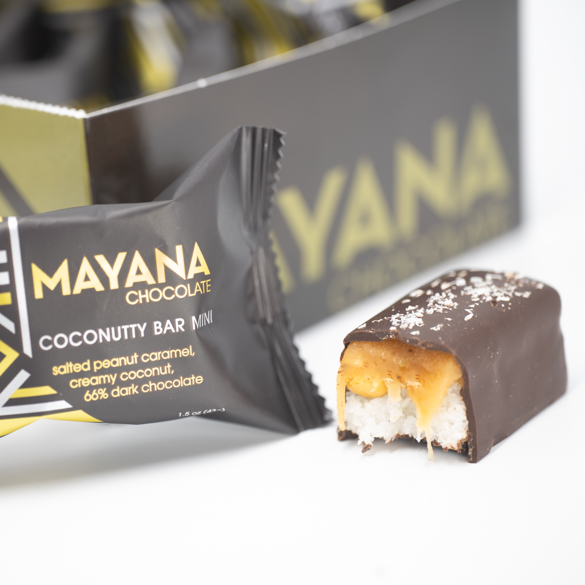 Mayana Chocolate Mini Coconutty Bar with bite revealing coconutty filling