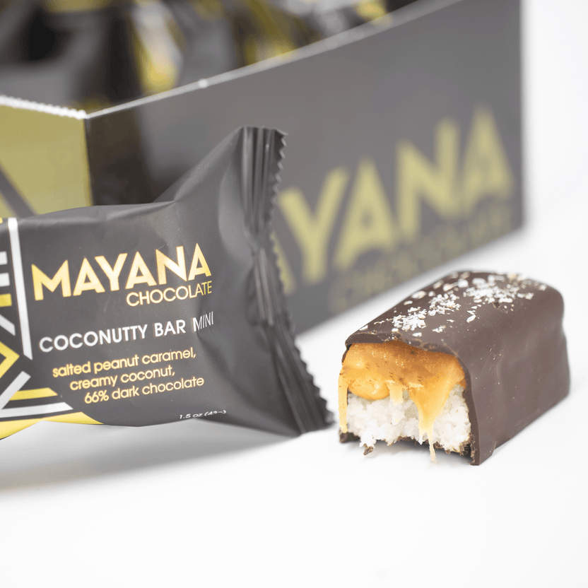Mayana Chocolate Mini Coconutty Bar with bite revealing coconutty filling