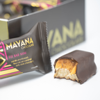 Partially eaten Mayana Chocolate Mini Fix Bar with dark chocolate, vanilla shortbread, fleur de sel caramel