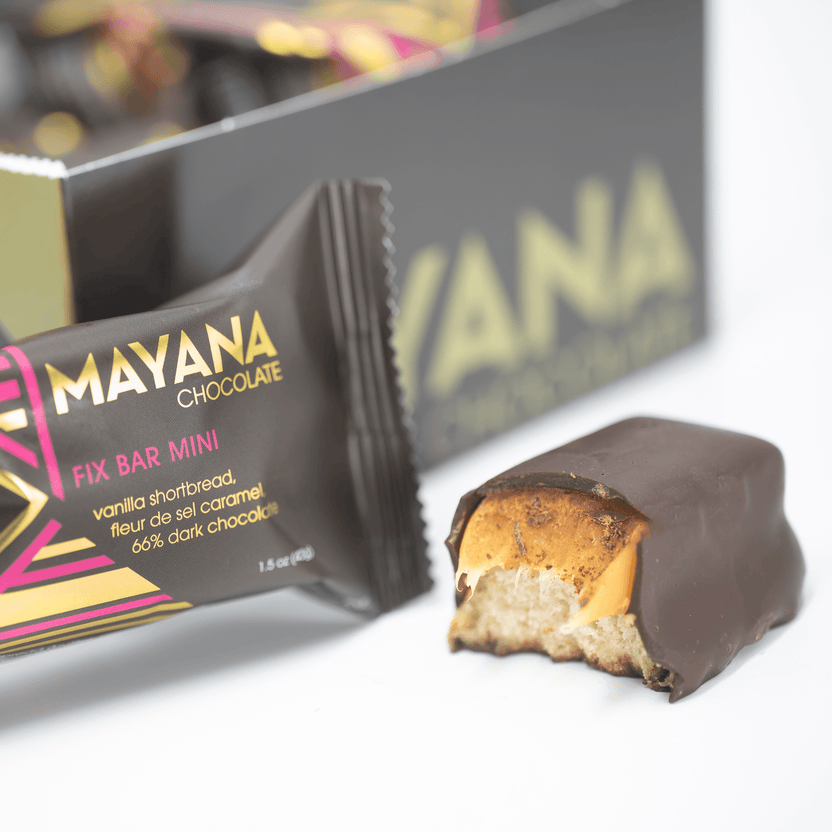 Partially eaten Mayana Chocolate Mini Fix Bar with dark chocolate, vanilla shortbread, fleur de sel caramel