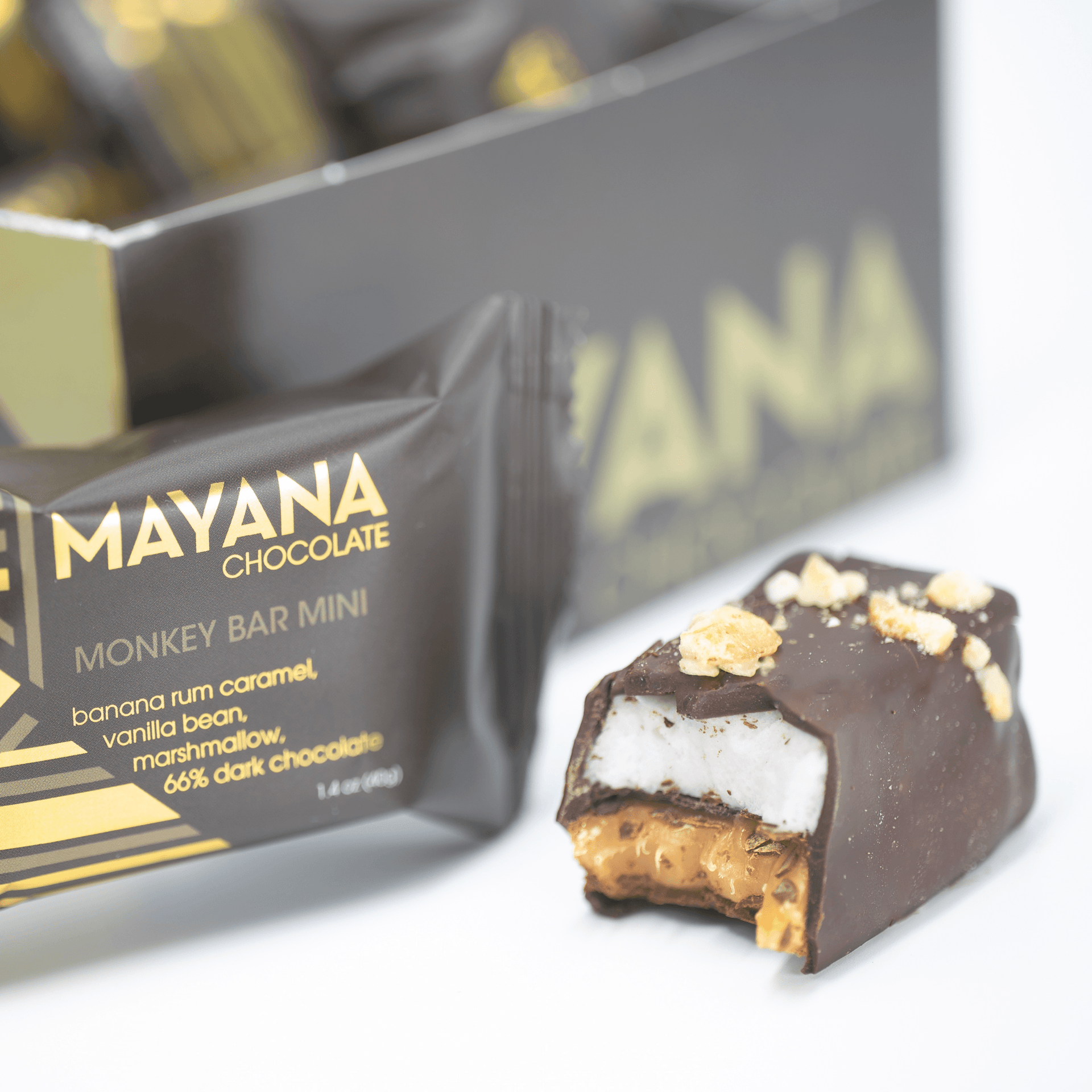Partially eaten Mayana Chocolate Mini Monkey Bar with banana rum caramel center