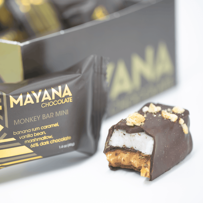 Partially eaten Mayana Chocolate Mini Monkey Bar with banana rum caramel center