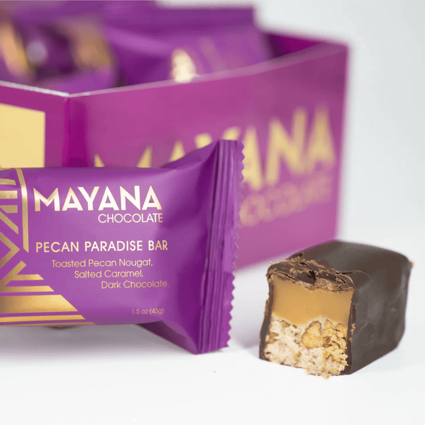 Mayana Chocolate Mini Pecan Paradise bar: purple wrap, gold geometric design