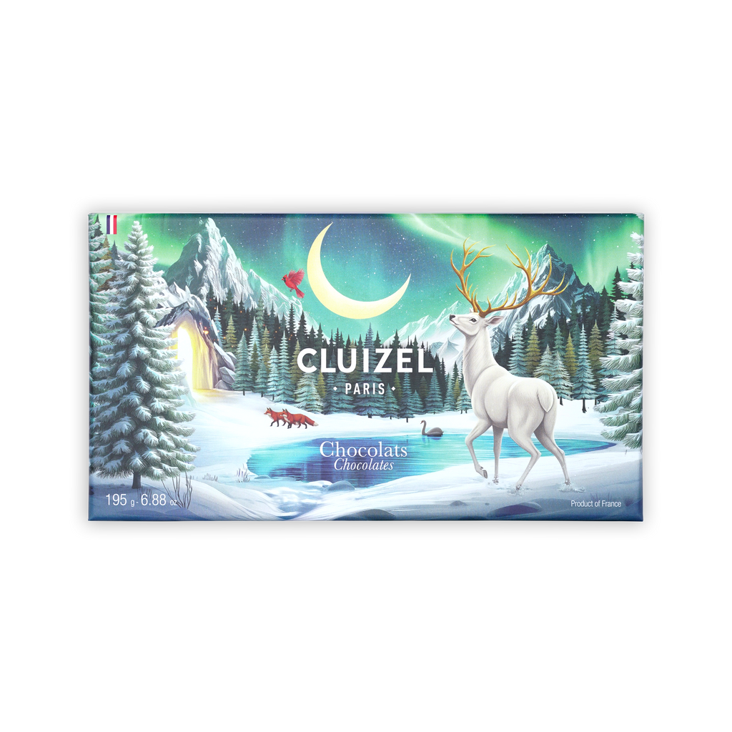 Rectangular Cluizel Paris Chocolats box with a winter scene of a white stag and northern lights on a black background.